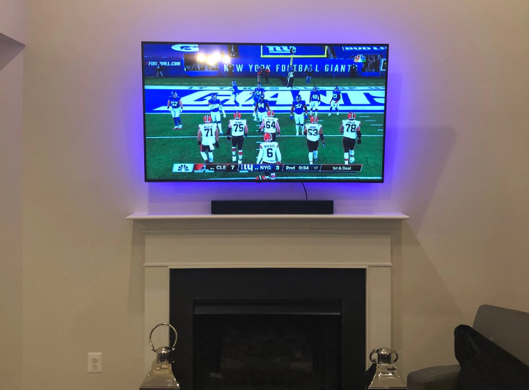 wall mounted TV with football playing owings mills md